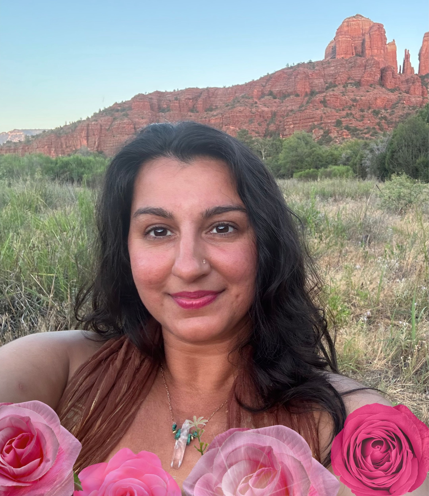 Dr. Rameet Singh surrounded by roses in Sedona